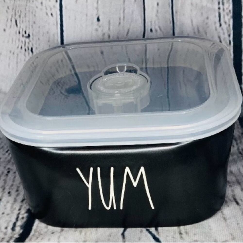 Copied - Rae Dunn portable food container with lid. Says Yum on front.